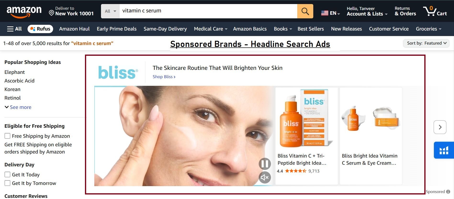Amazon search results featuring a 'Bliss' sponsored ad for Vitamin C skincare, showing products and a woman applying serum.