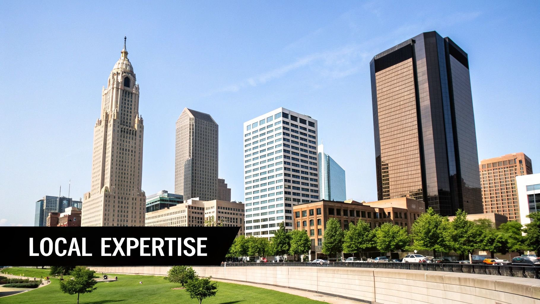 A city skyline with several prominent skyscrapers, a green park, and a road under a blue sky, with 'LOCAL EXPERTISE' text.