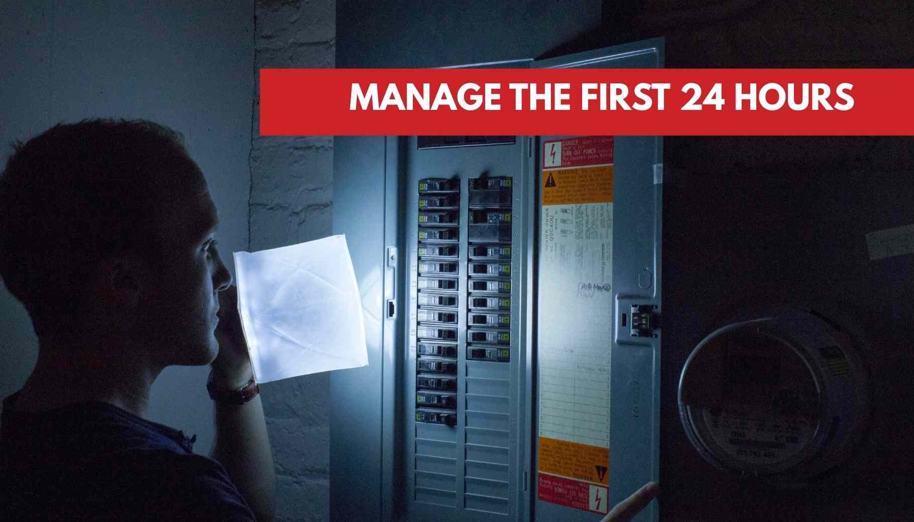 A man uses a bright portable light to examine an open electrical panel during a power outage.