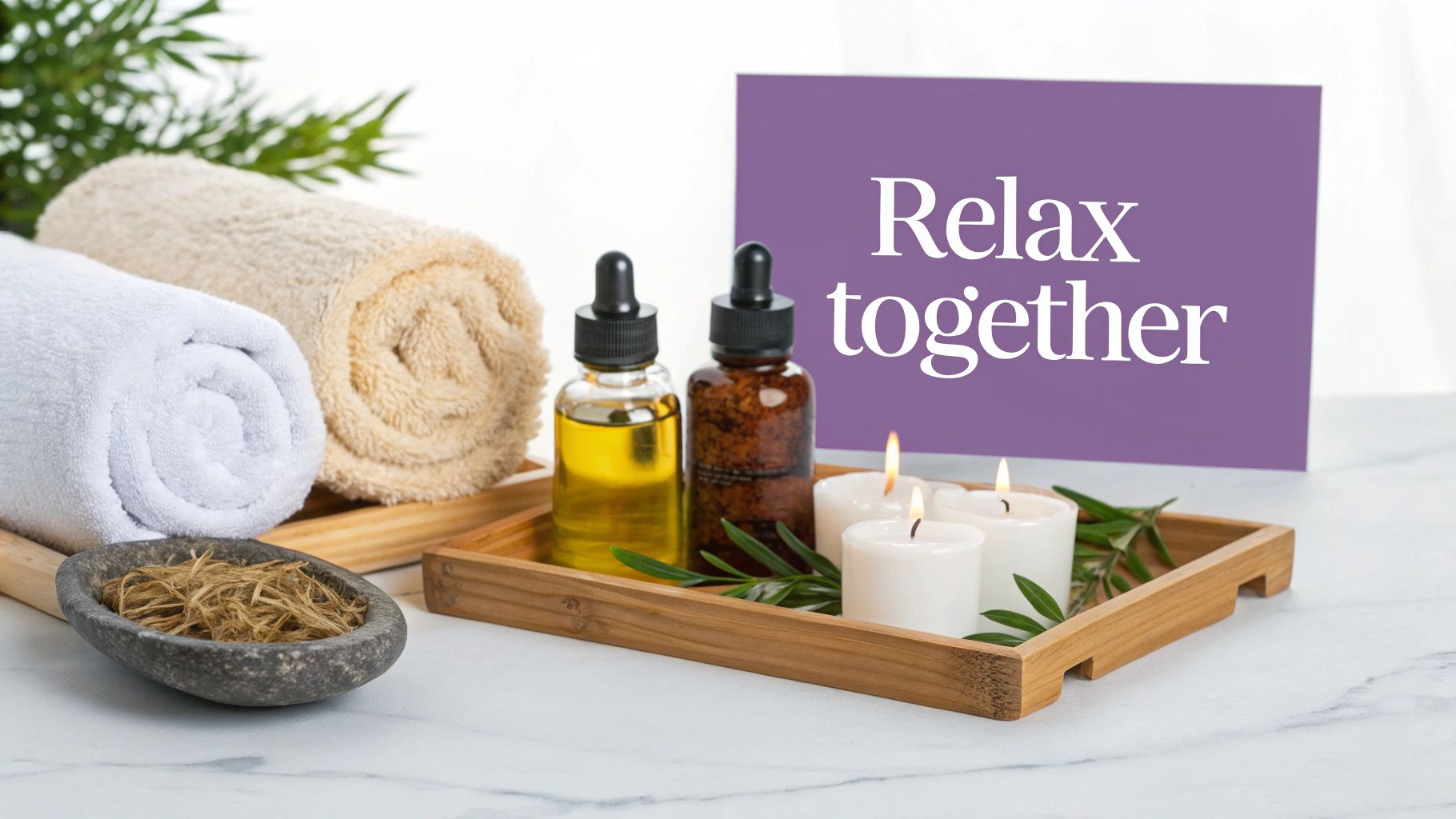 Spa relaxation setup with essential oils, rolled towels, candles, and relax together sign