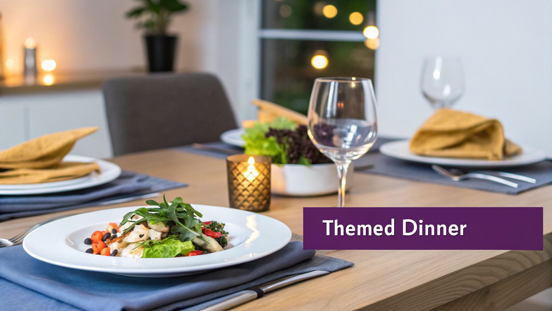 Elegant themed dinner table setting with gourmet salad, wine glasses, and candlelight at home