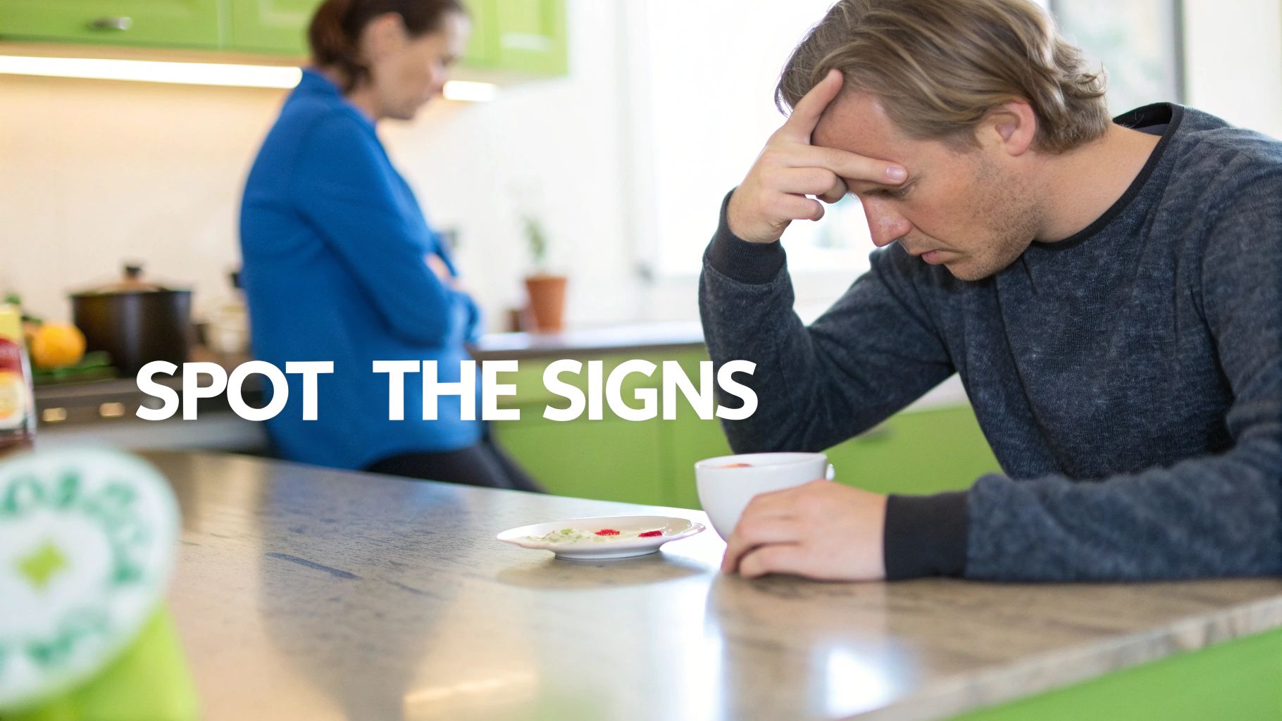 A parent looking tired and stressed while sitting on the floor, surrounded by toys.