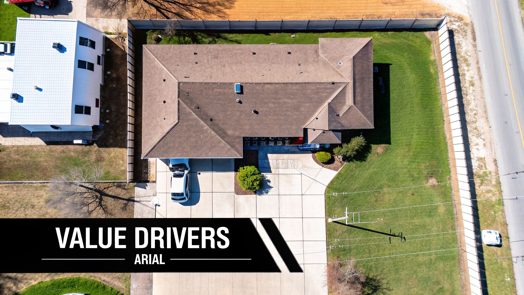 A panoramic view of a Dubai community showing villas, apartments, and nearby amenities like parks and roads.