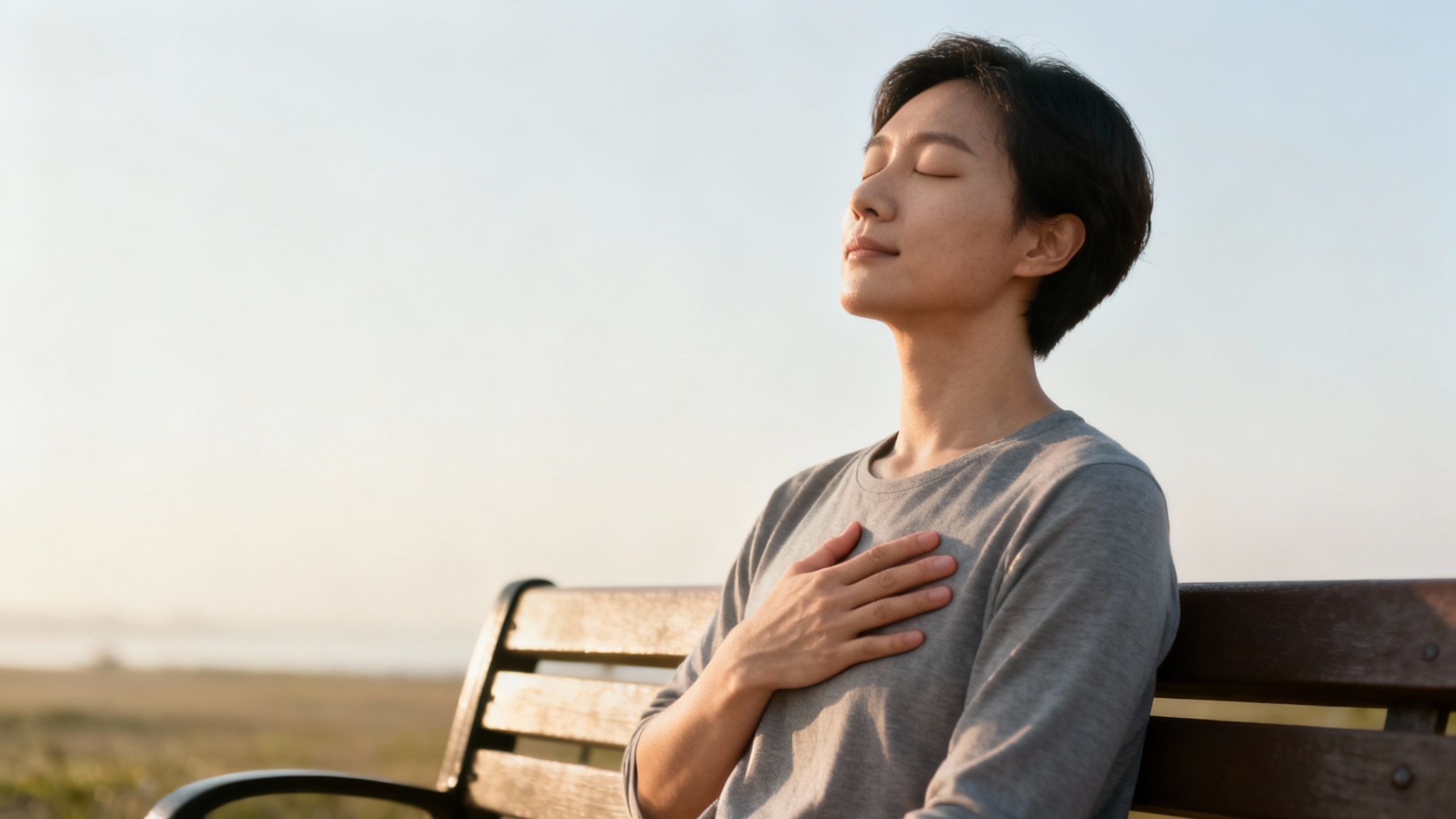 A strong, resilient tree standing alone in a field, symbolizing emotional strength.