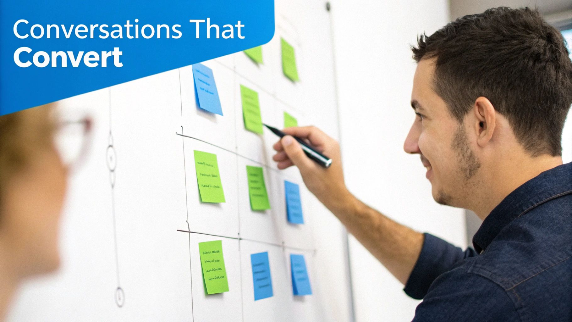 A person designing a conversation flow on a whiteboard, illustrating the strategic process behind chatbot interactions.