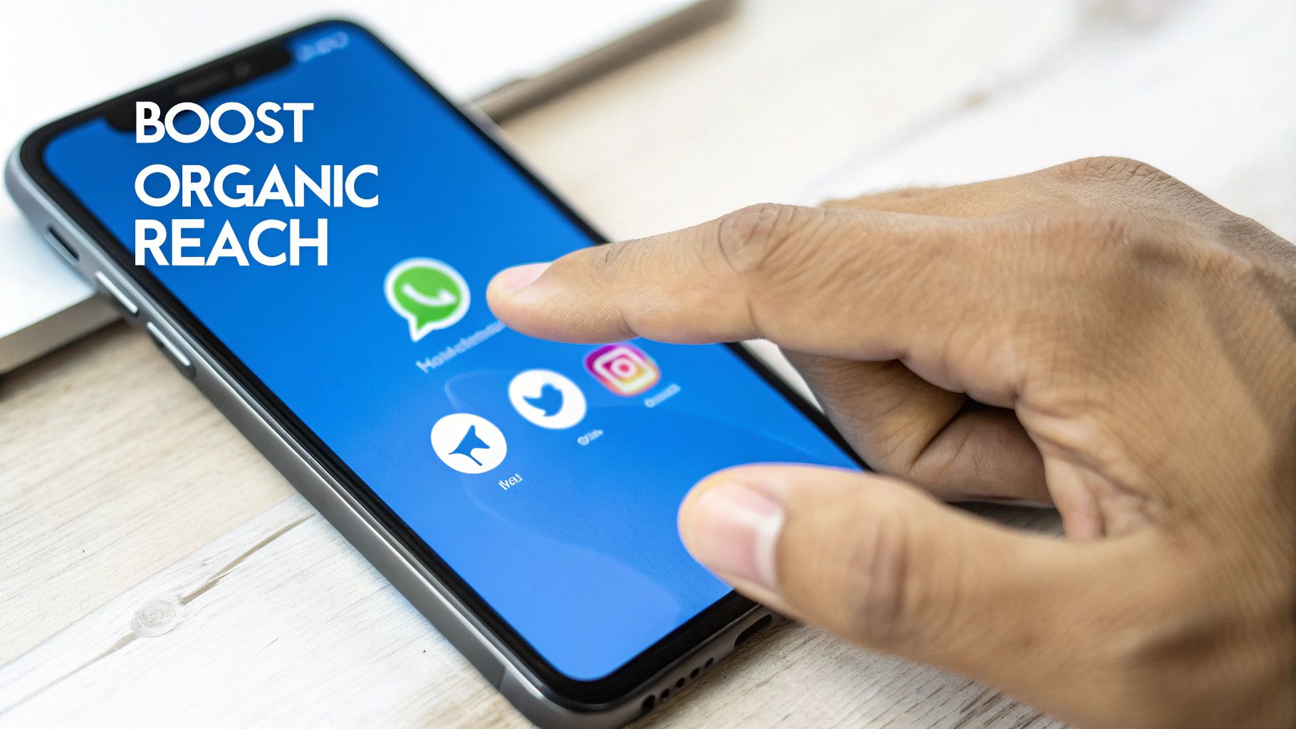 A hand taps a smartphone screen displaying social media apps and the text 'BOOST ORGANIC REACH'.