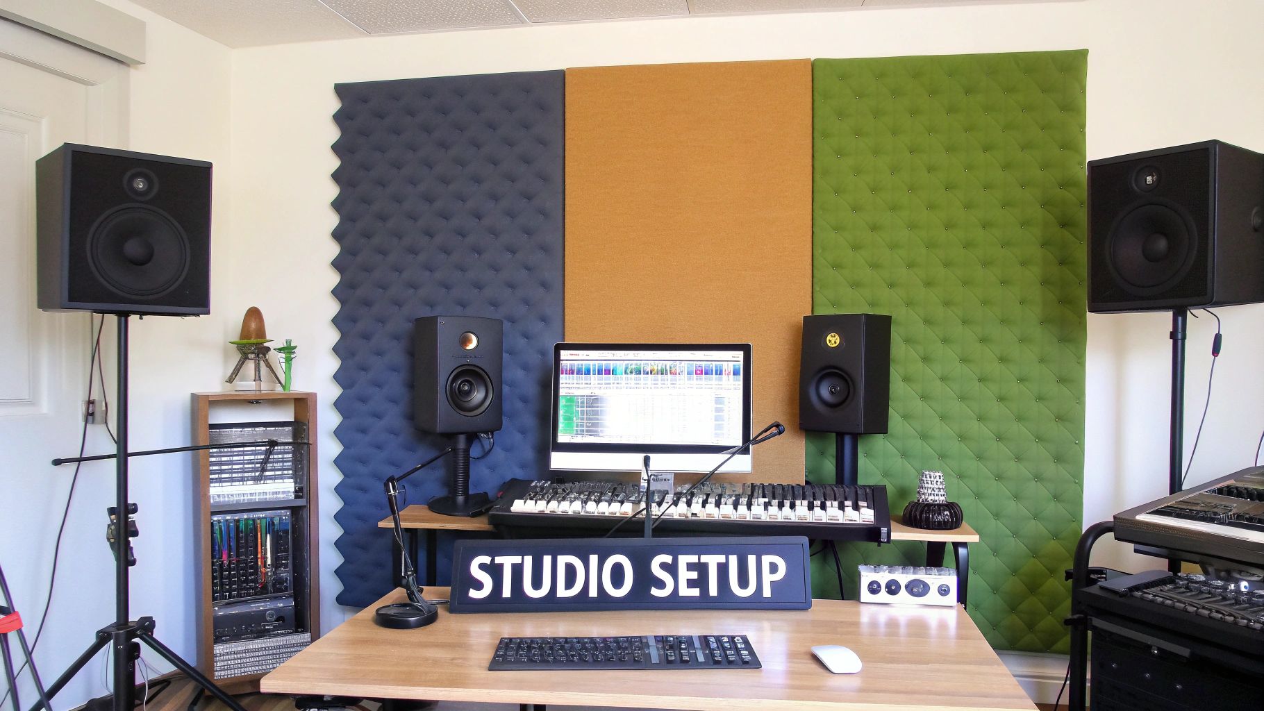 A modern music production studio with glowing monitors, a mixing console, and acoustic treatment on the walls.