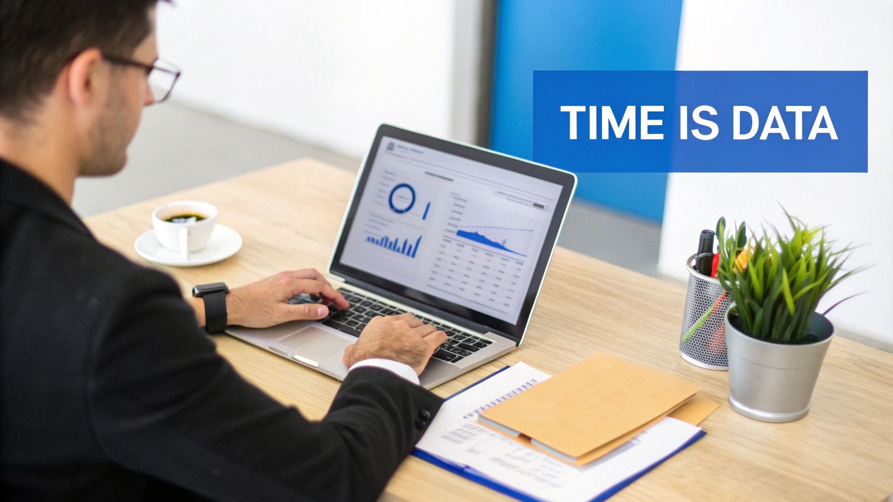 A professional services team collaborating around a table with laptops and documents, discussing project data.