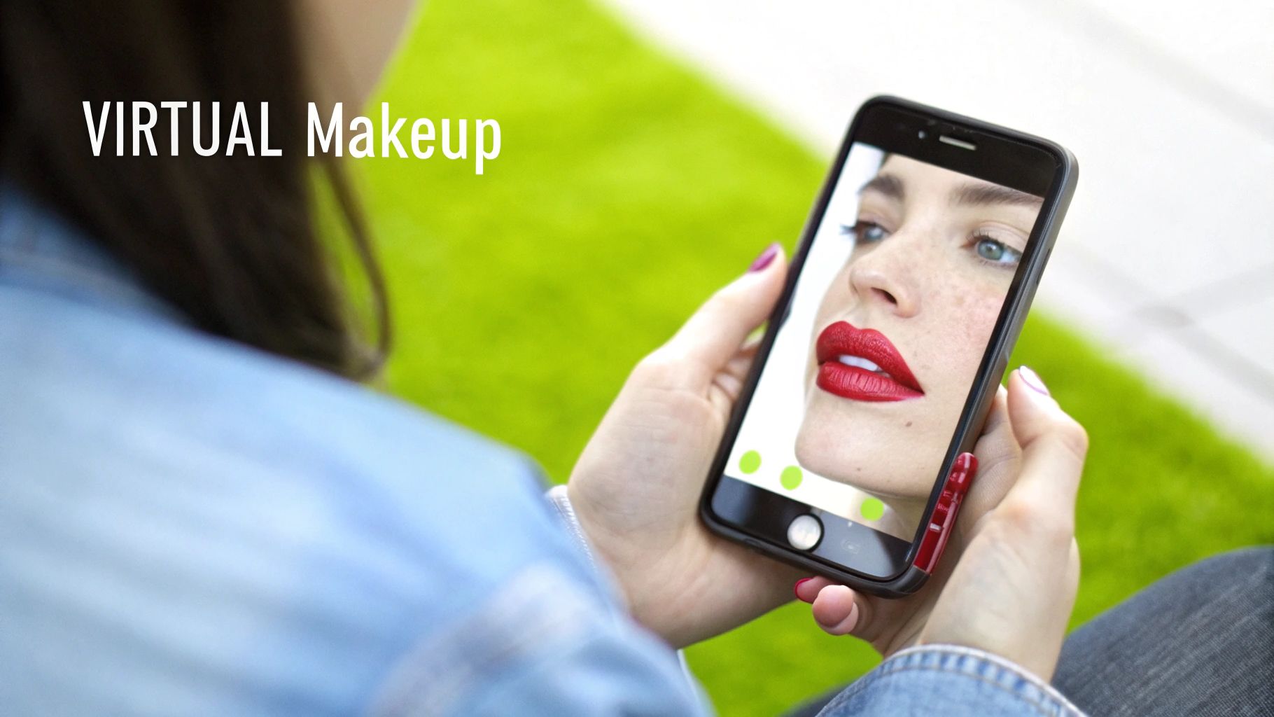 A person holds a smartphone displaying a woman's face with virtual red lipstick, signifying virtual makeup.