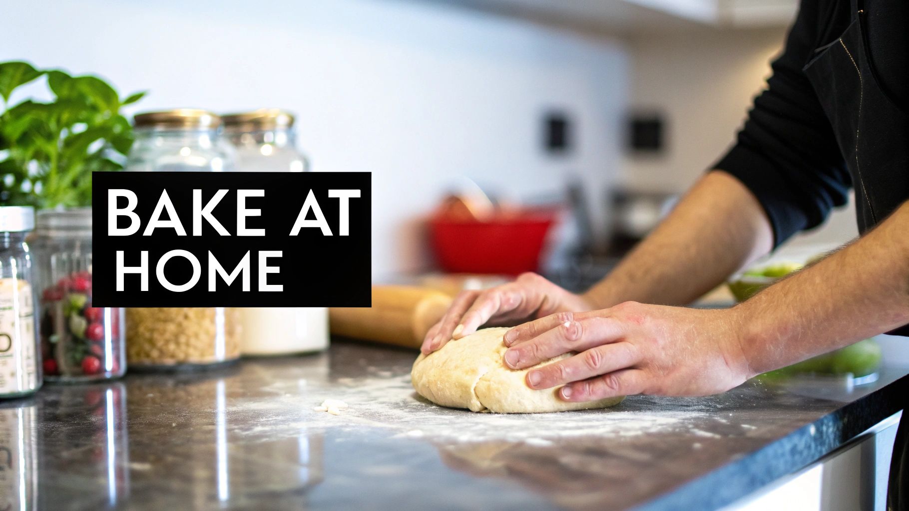 A person's hands knead dough on a floury kitchen counter, with "BAKE AT HOME" text.