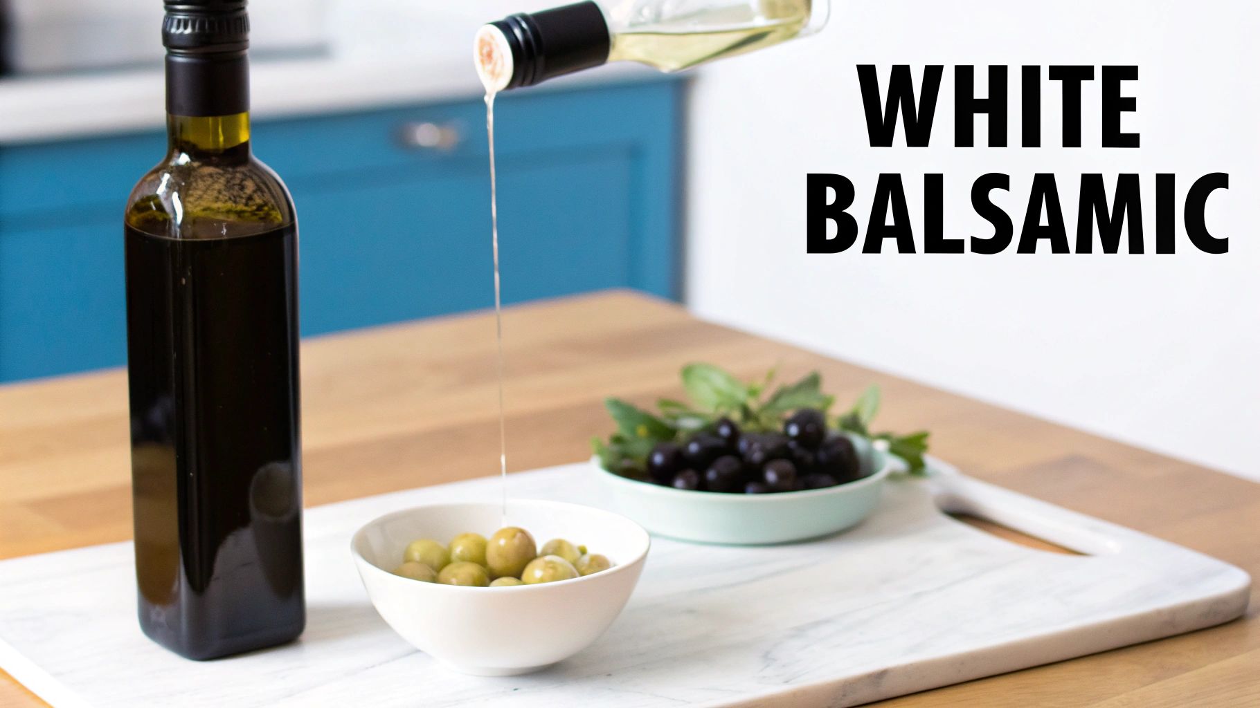 White balsamic vinegar being poured into green olives, with black olives and a dark bottle.