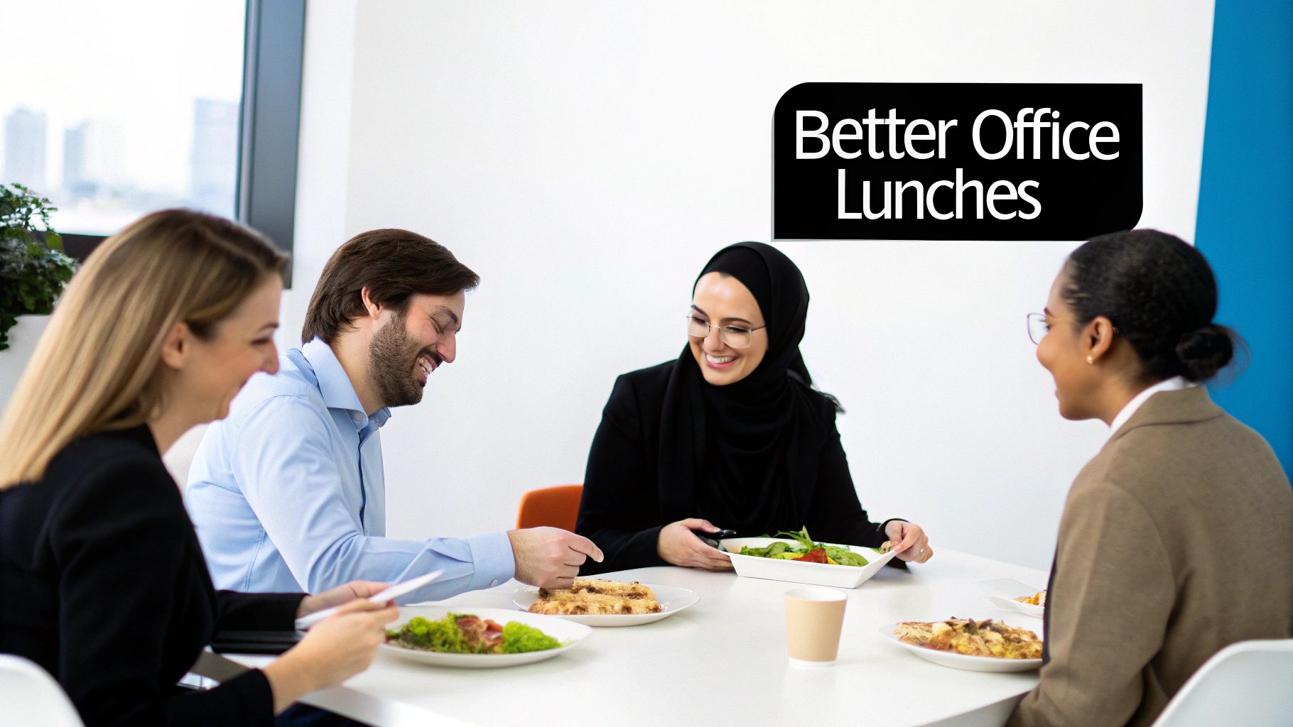 Four diverse office colleagues smiling while enjoying a catered lunch at a modern office table.