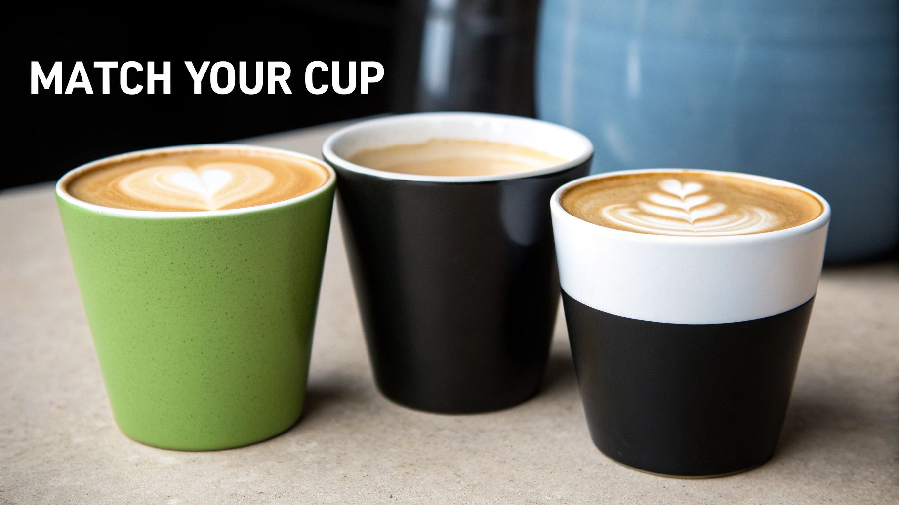 Different styles of coffee cups and mugs arranged on a table.