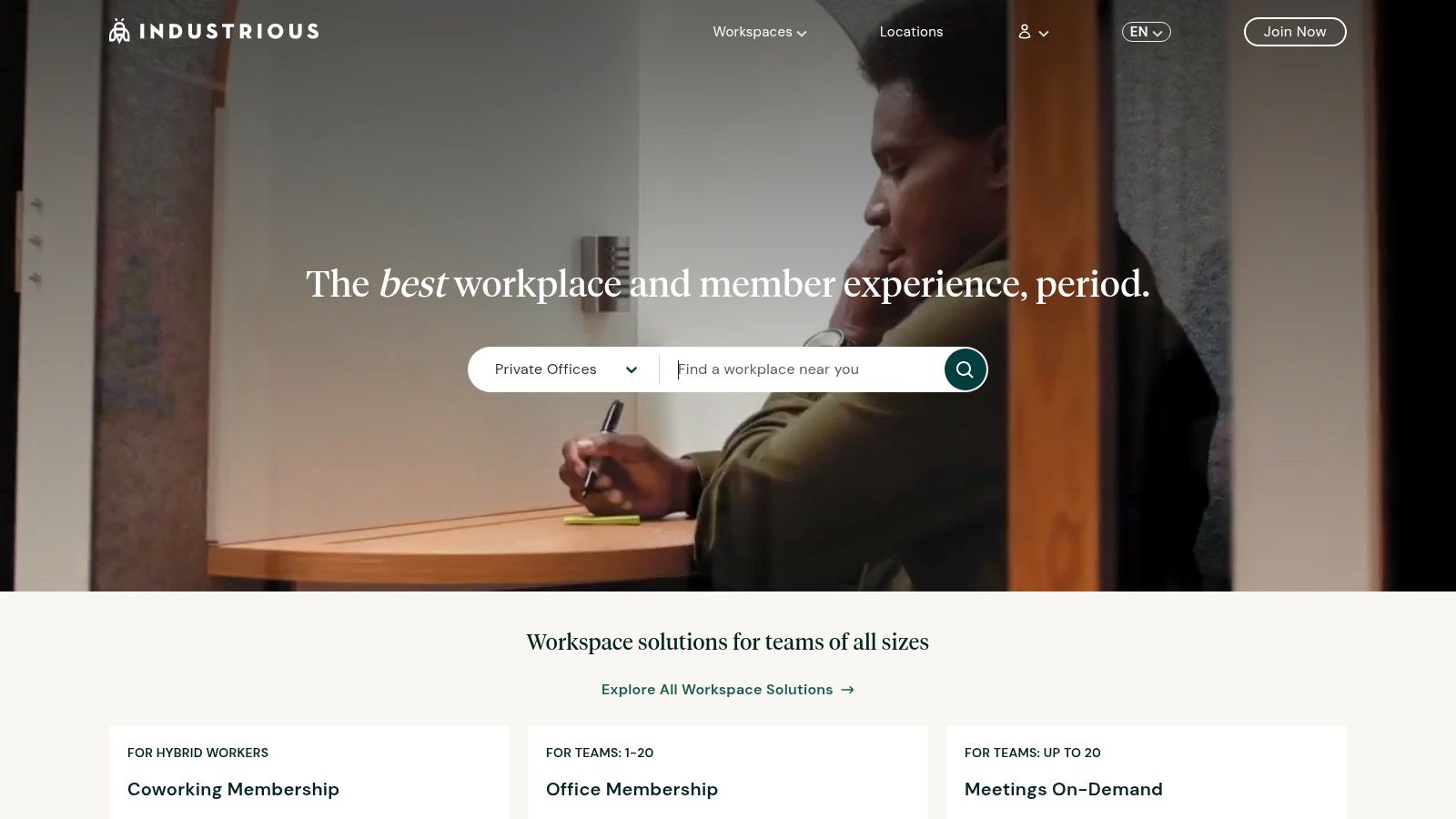 A stylish, modern private office with large windows at an Industrious location