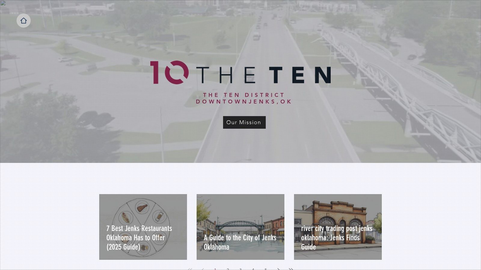 A street view of The Ten District in Jenks, showcasing its charming storefronts and walkable design.