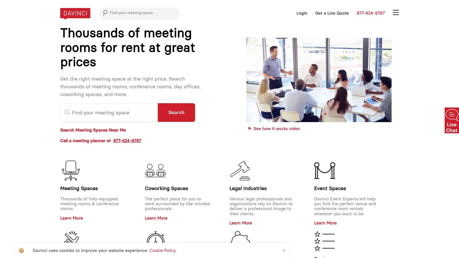 A professional boardroom with a dark wood table, leather chairs, and a large window overlooking a city.