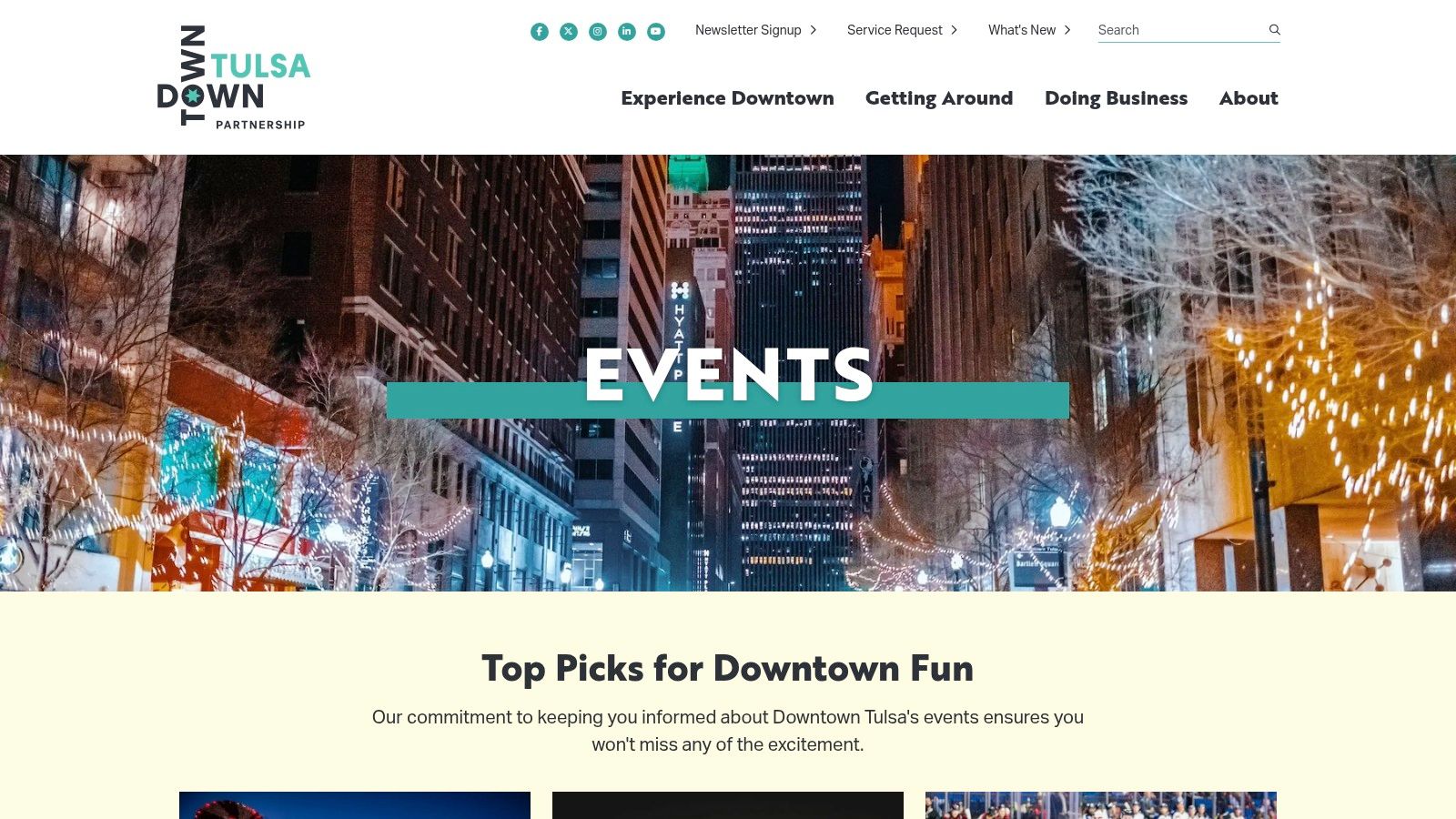 The downtown Tulsa skyline at dusk, highlighting the vibrant city center that the Downtown Tulsa Partnership calendar focuses on.