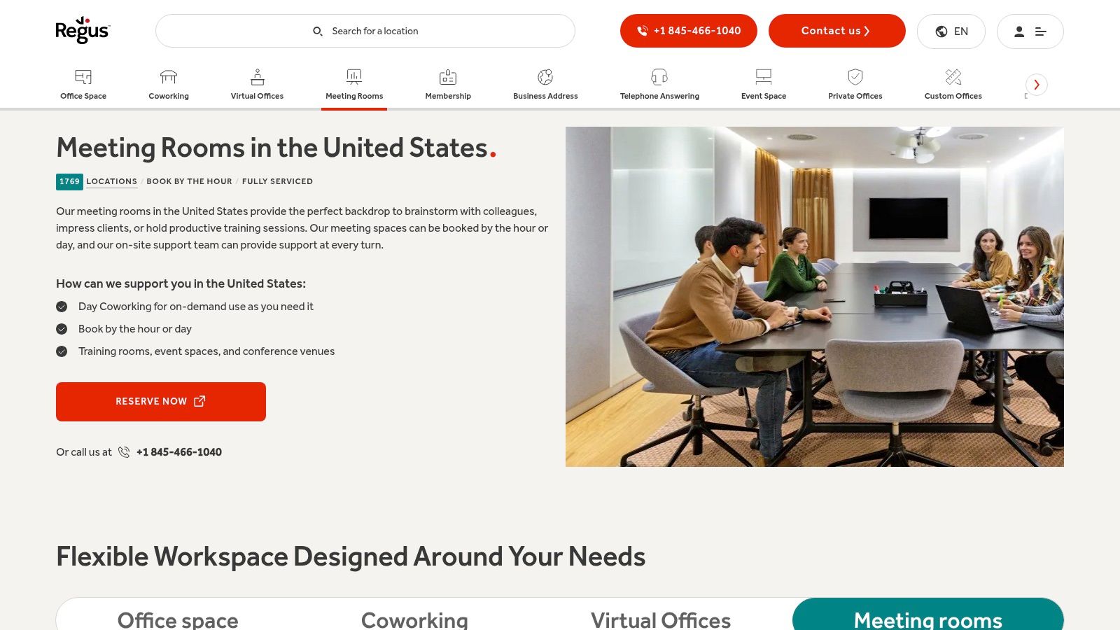 A professional meeting in progress inside a modern Regus boardroom with city views.