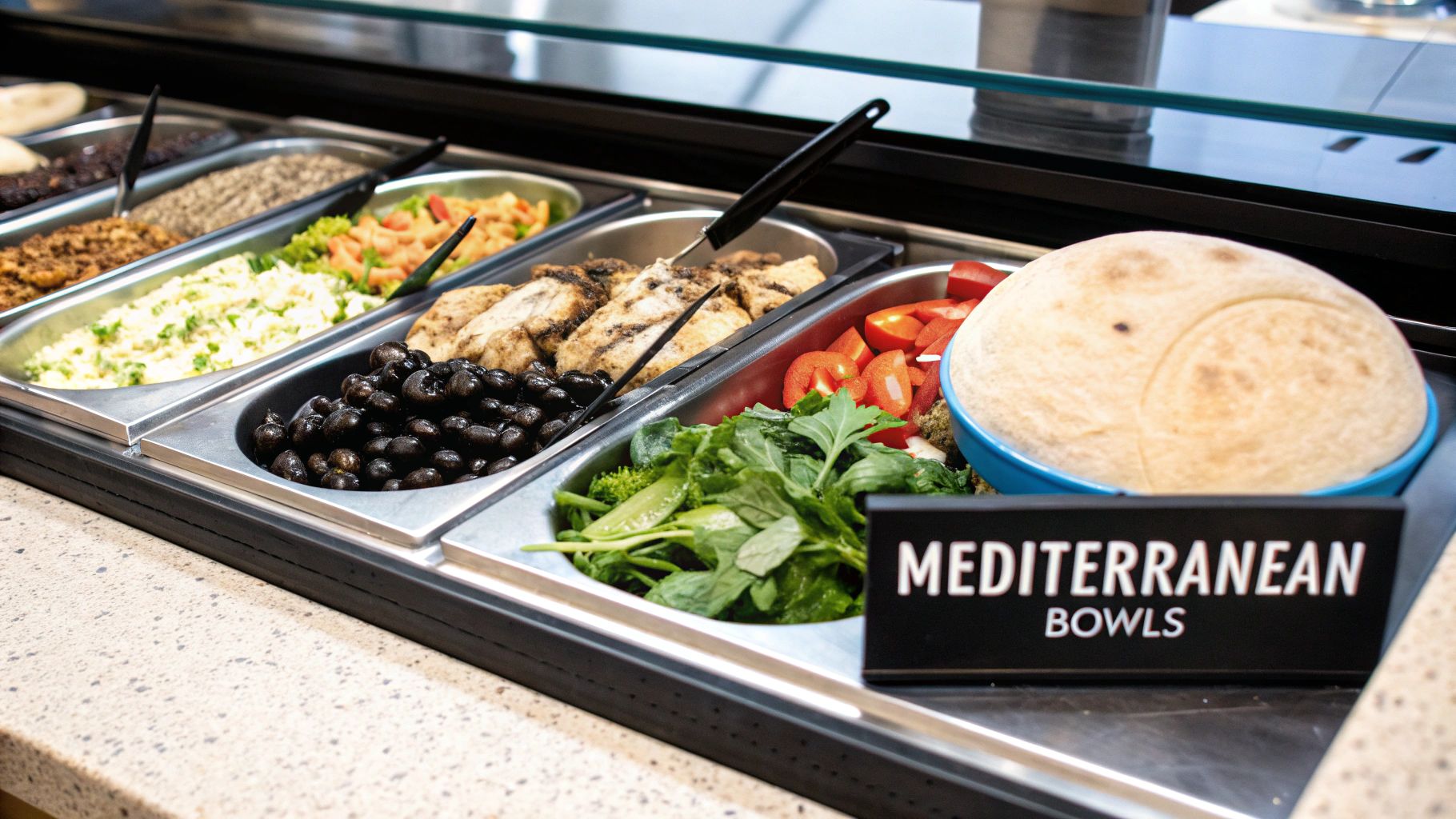 A delicious-looking Mediterranean bowl with various fresh ingredients