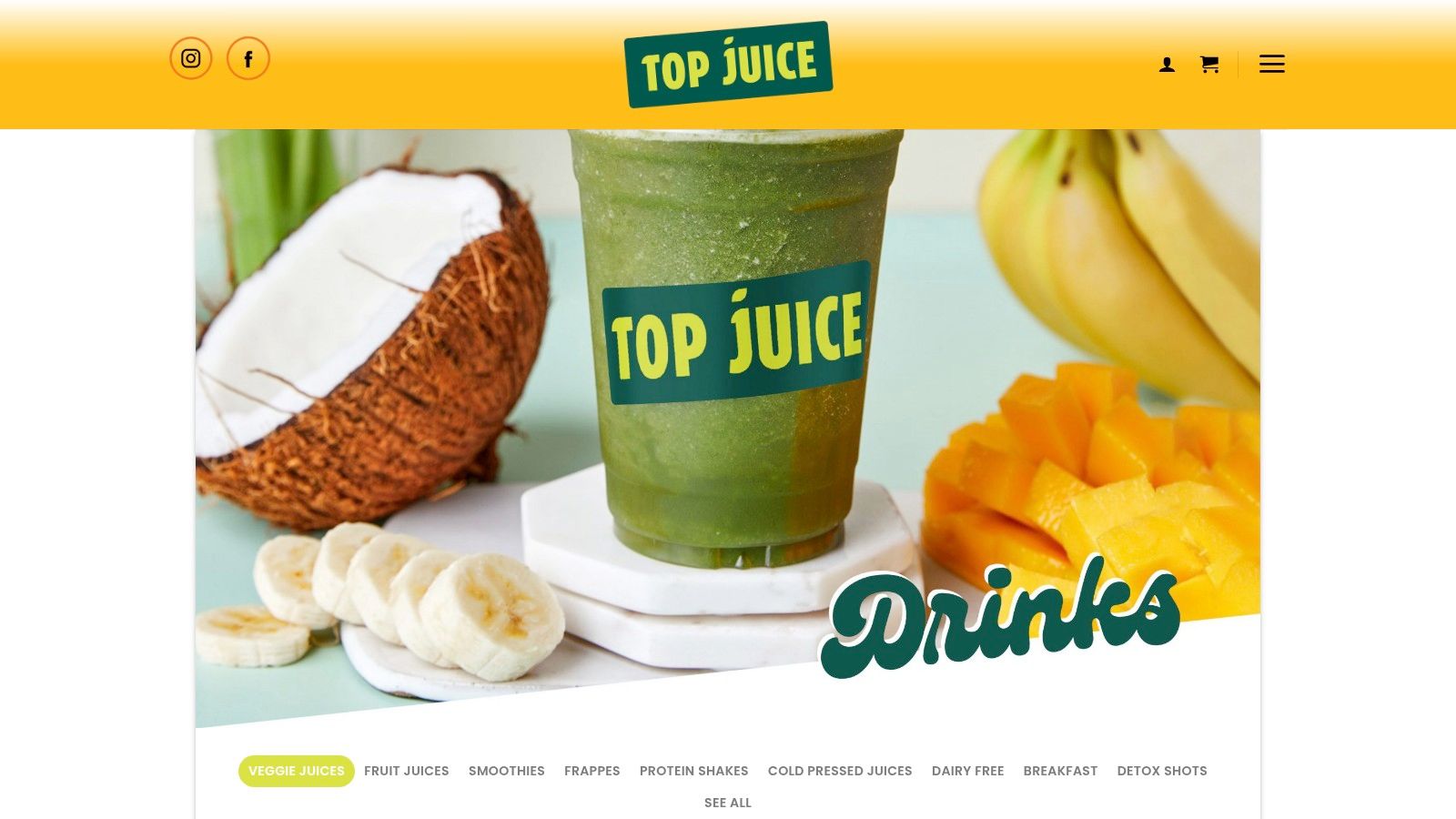 A vibrant green smoothie from Top Juice, garnished with fresh mint, sitting on a wooden table.