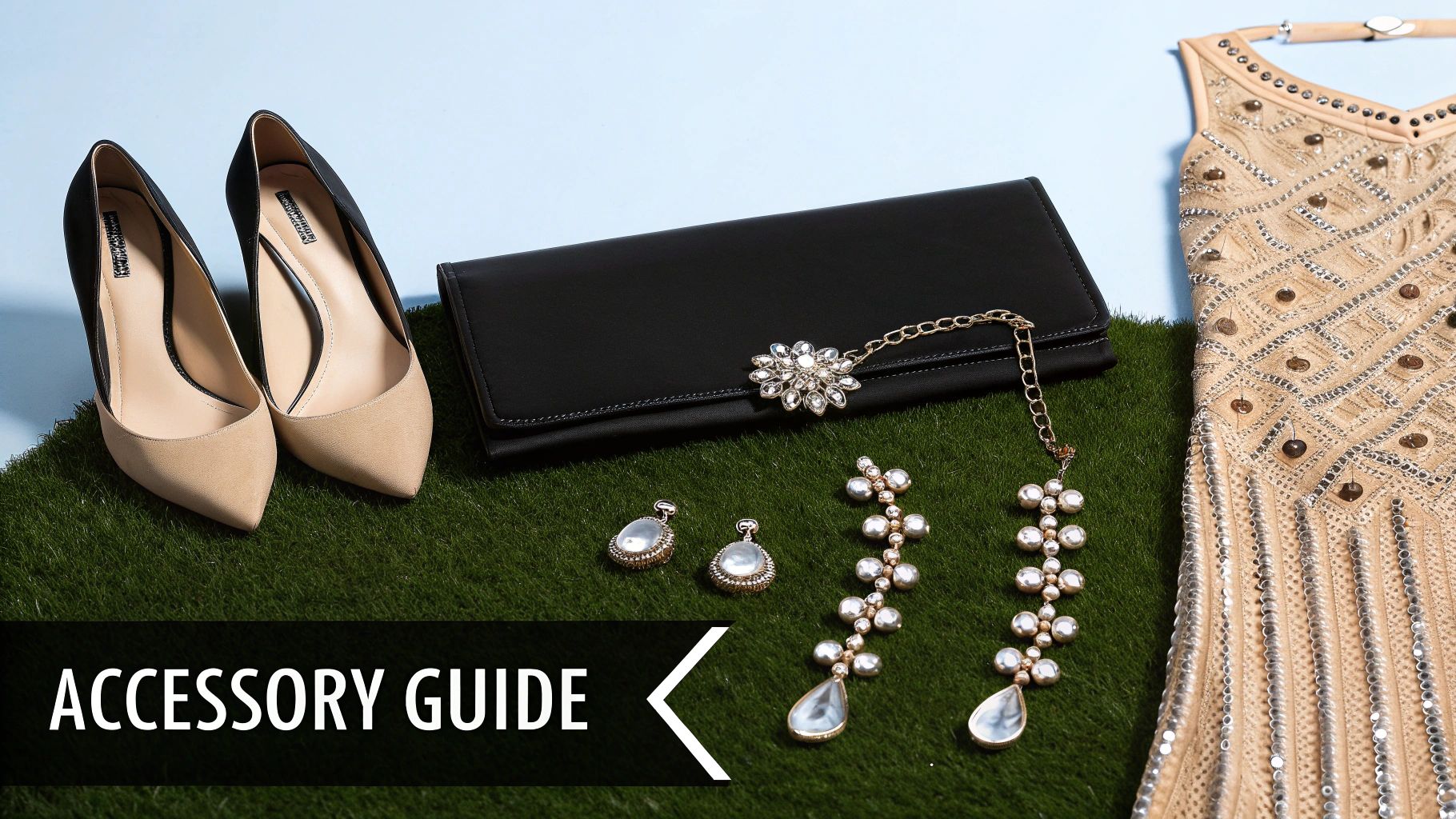 A collection of elegant accessories including beige heels, a black clutch, pearl earrings, and a beaded dress on green grass.