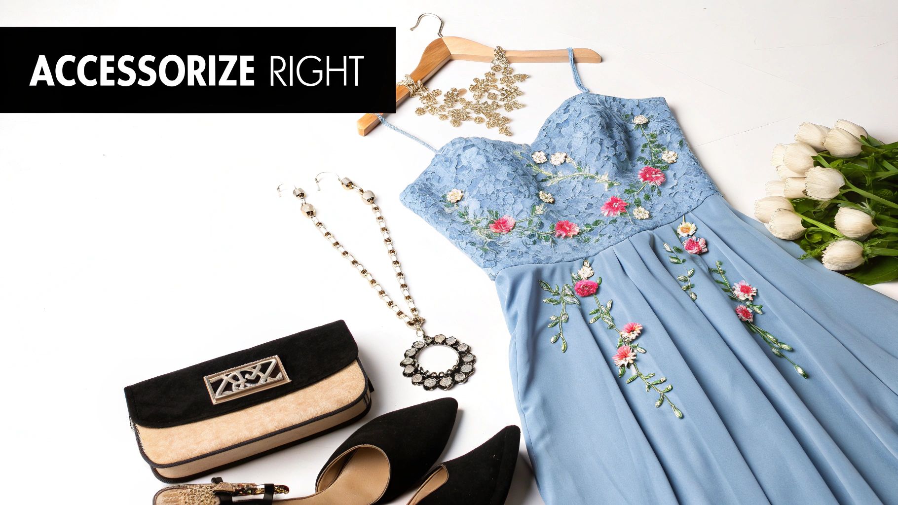 Blue floral embroidered prom dress styled with black heels, clutch, statement necklace and gold accessories