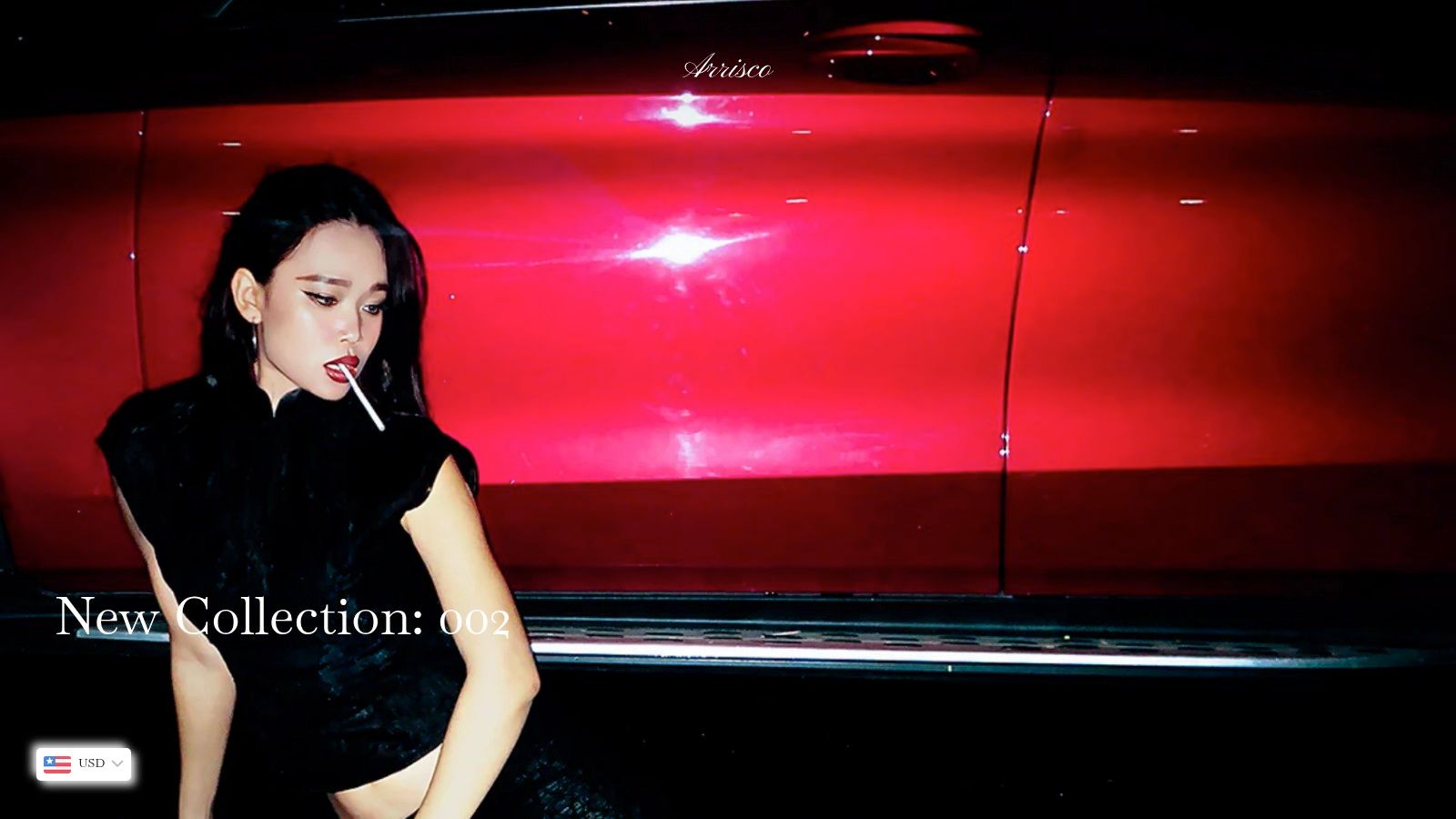 A woman in a stylish red dress from a Vietnamese local brand, posing in front of a classic red car, showcasing vintage allure.