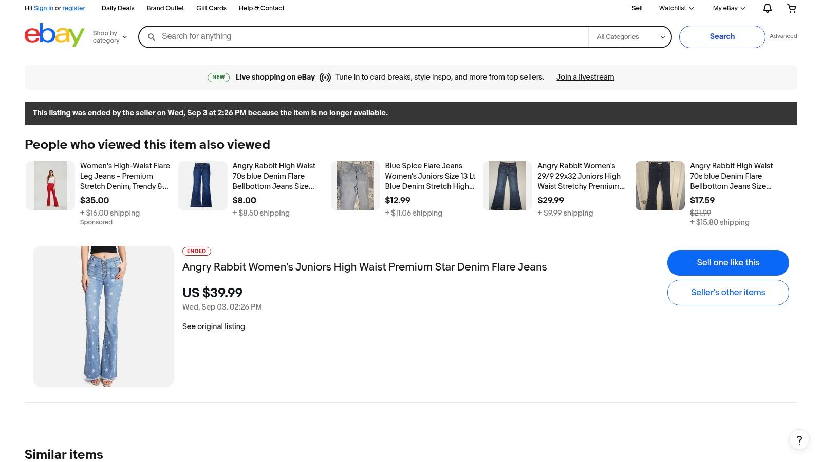 A pair of Free People flare jeans with stars listed on eBay