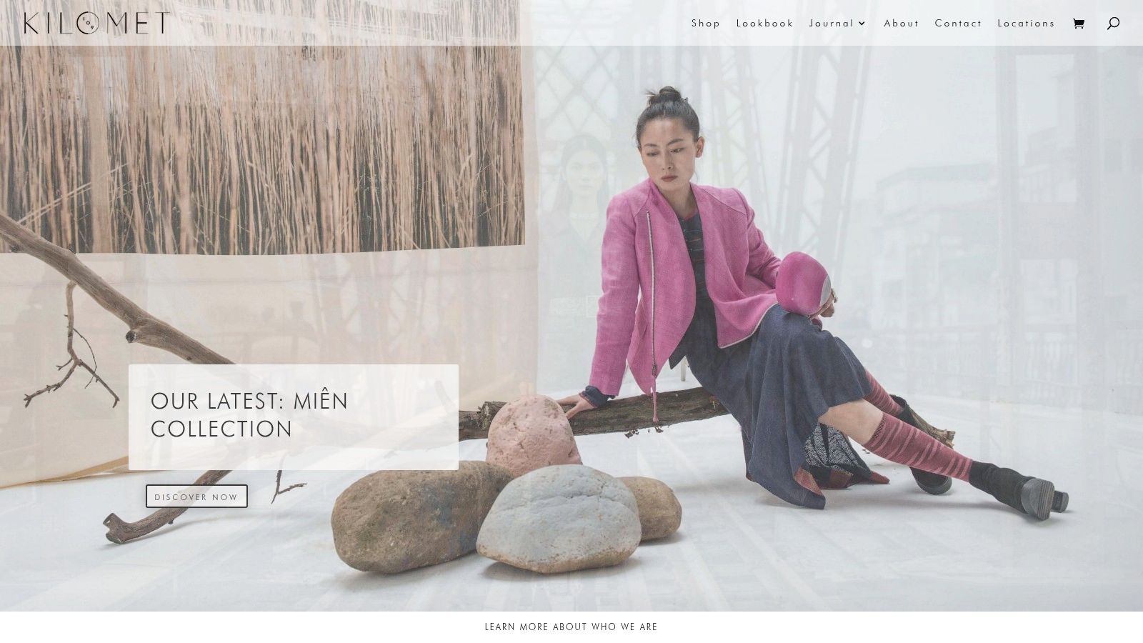 A fashion model showcasing a distinctive, naturally dyed garment from Kilomet109.