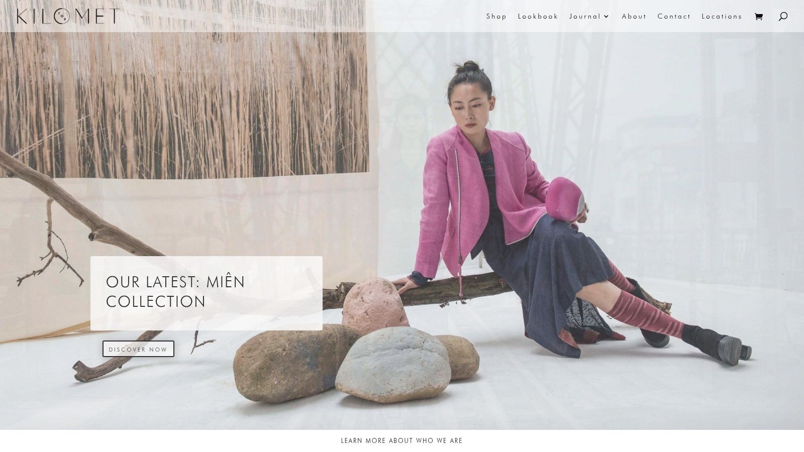 A model showcasing Kilomet109's contemporary design using hand-loomed, naturally-dyed textiles.