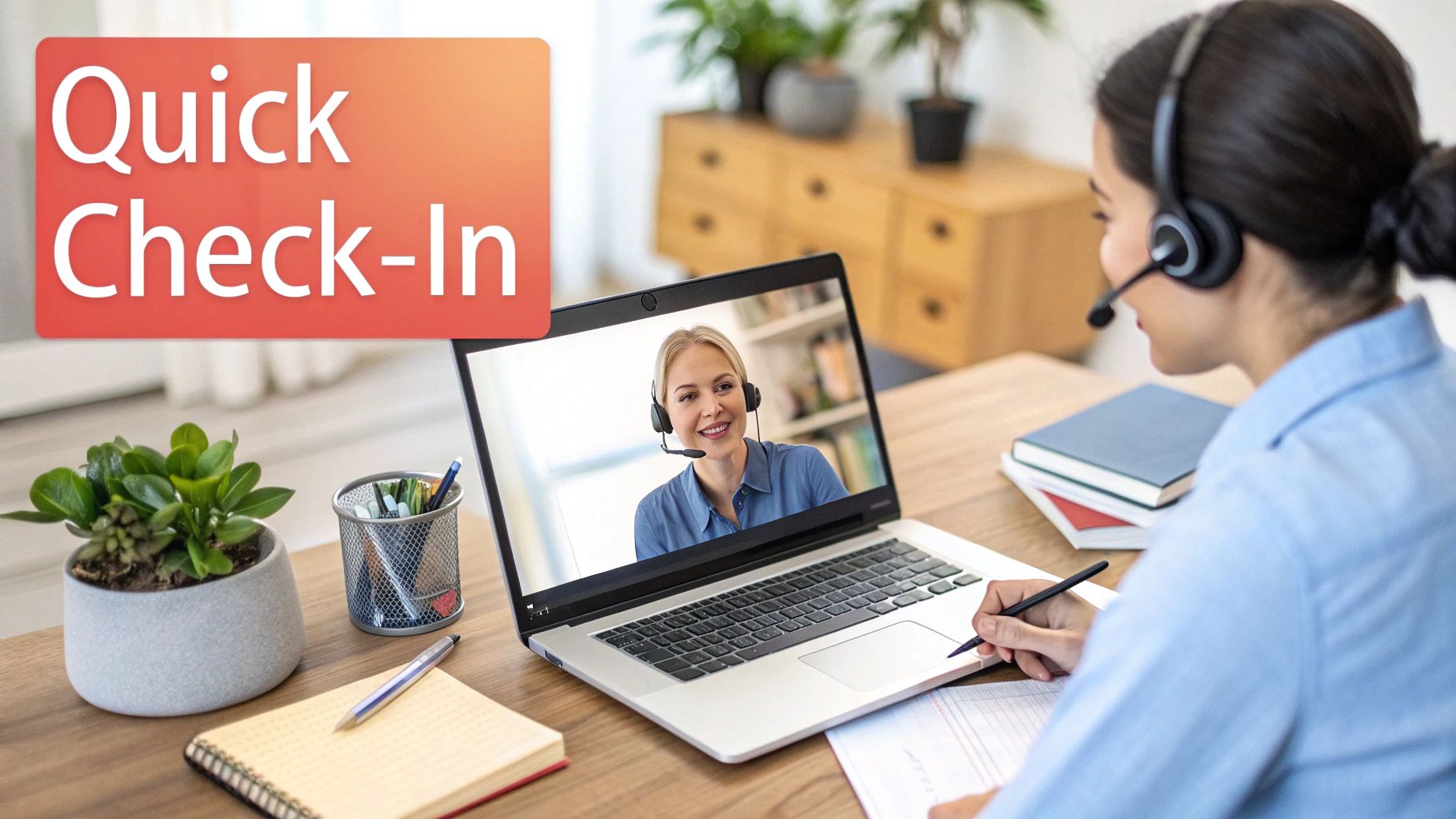 Two women conducting a quick virtual check-in on a laptop, both wearing headsets.