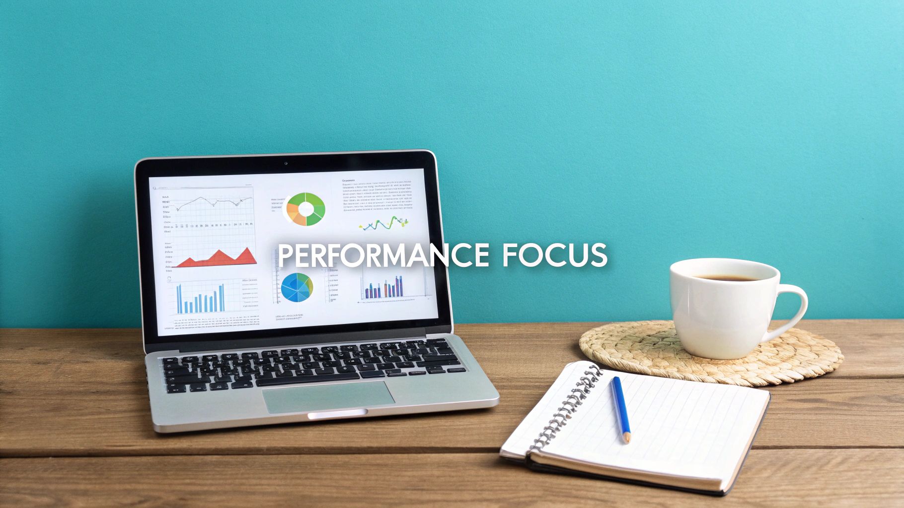 A laptop showing performance charts on a wooden desk with a coffee and notebook, text says PERFORMANCE FOCUS.