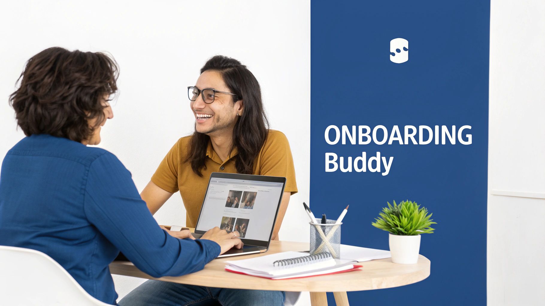 Two smiling colleagues collaborate on a laptop at a table, displaying 'ONBOARDING Buddy' text.
