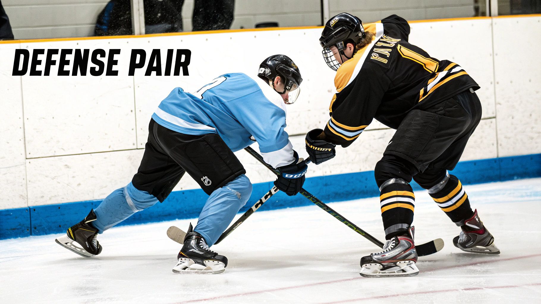 A Detroit Red Wings defenseman clears the puck from the defensive zone.