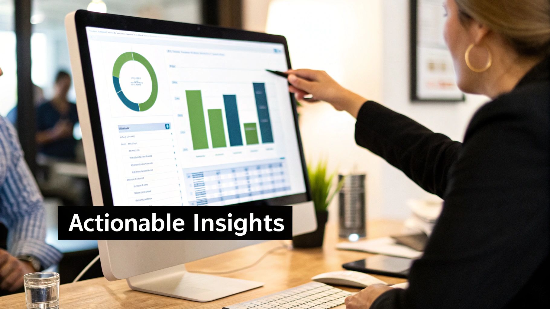 A business analyst measures digital marketing performance data on a screen.