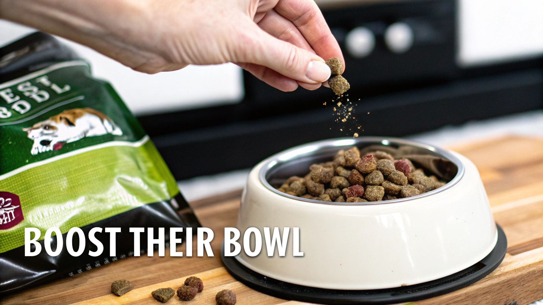 A hand drops natural dog food kibble into a full pet bowl, next to a food bag on a wooden table.