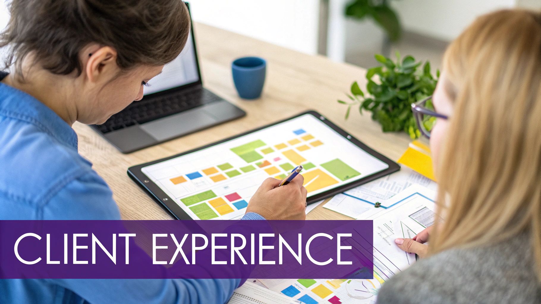 Two women collaborate on a client experience strategy, analyzing colorful charts and data on a desk.