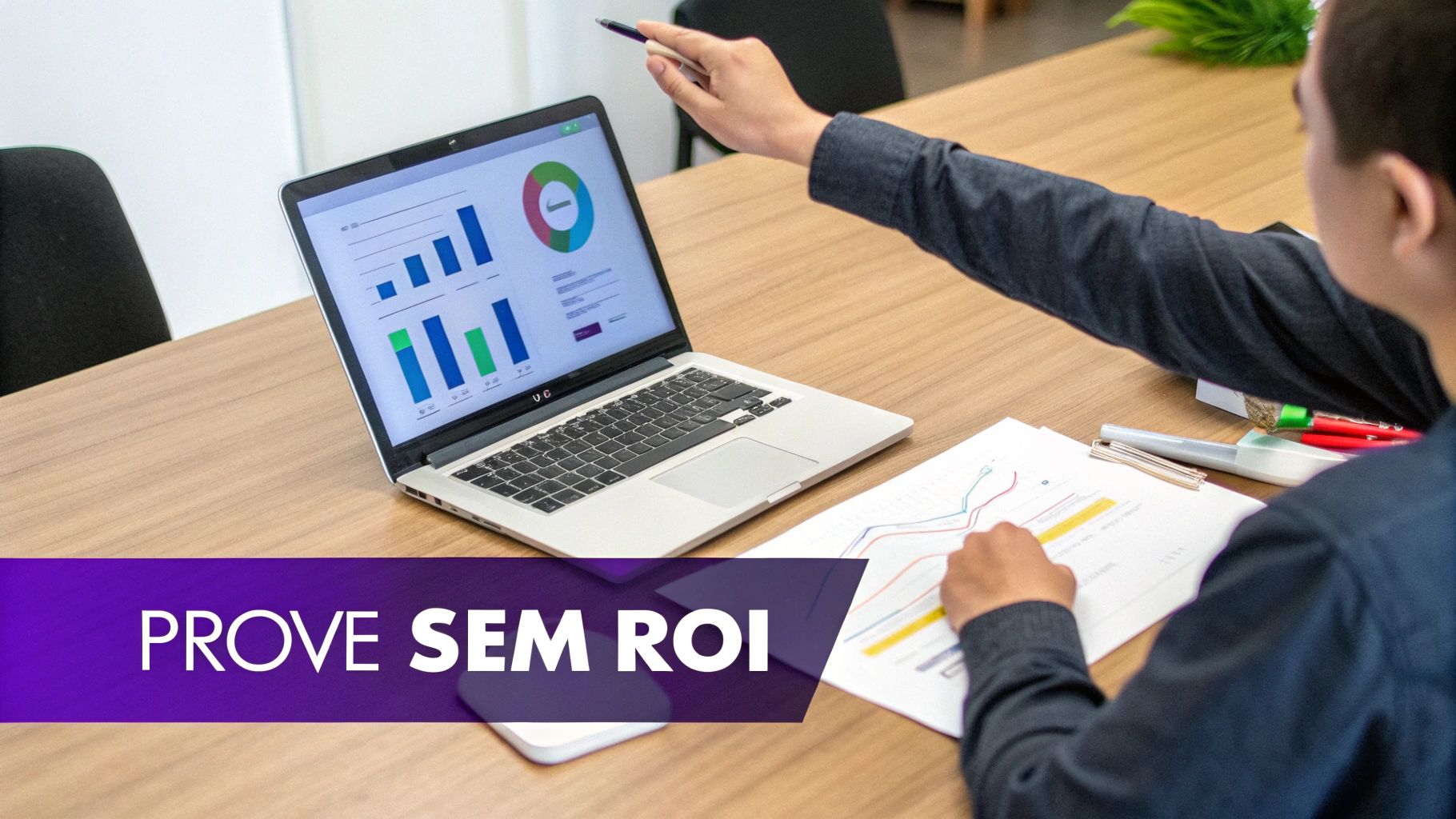 A person pointing at a laptop screen displaying various charts and graphs during a business meeting.