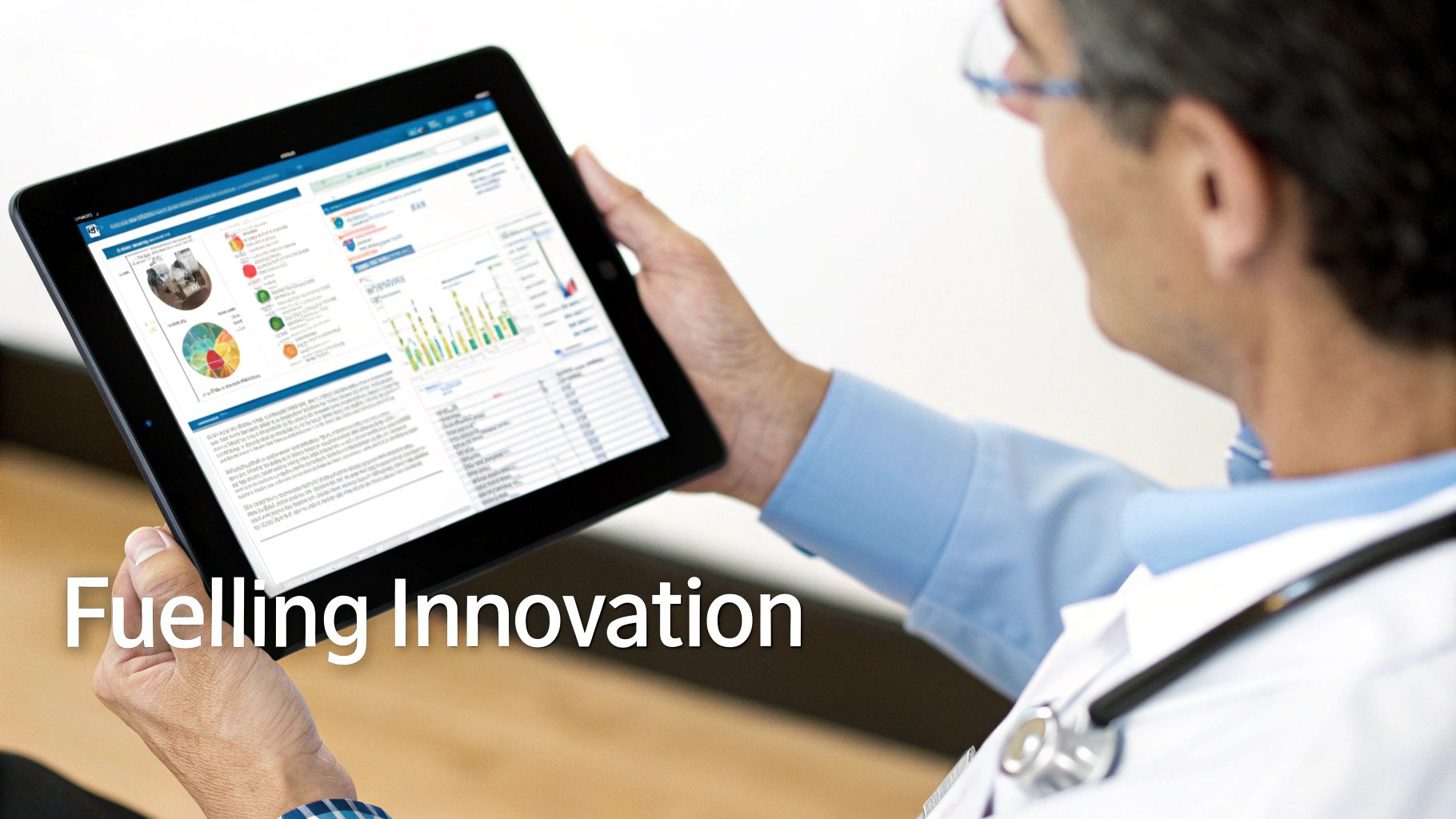 Healthcare professional reviewing data analytics dashboard on tablet displaying colorful charts and graphs