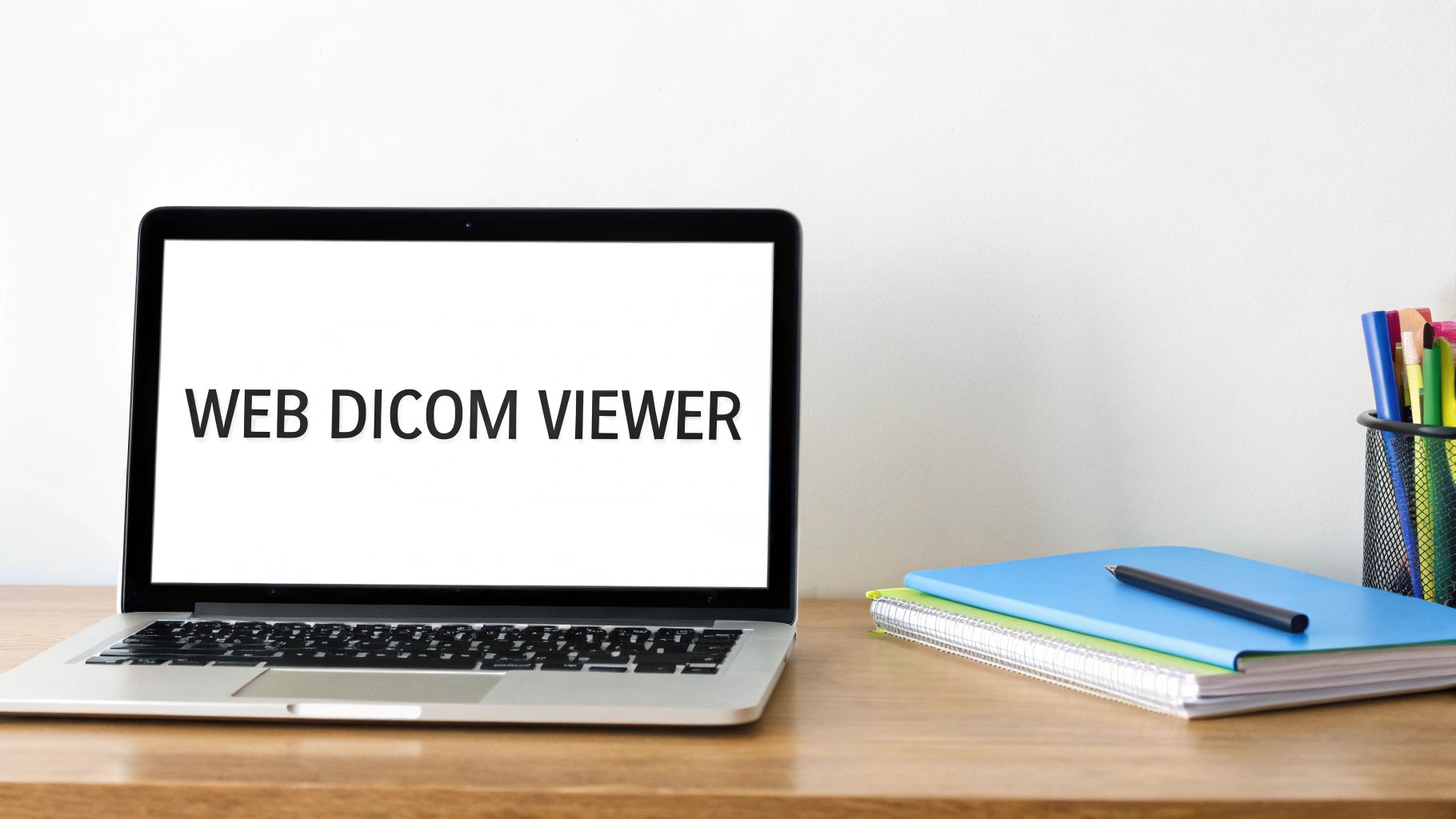 A web-based DICOM viewer on a laptop screen, showing a brain scan, representing modern medical imaging accessibility.