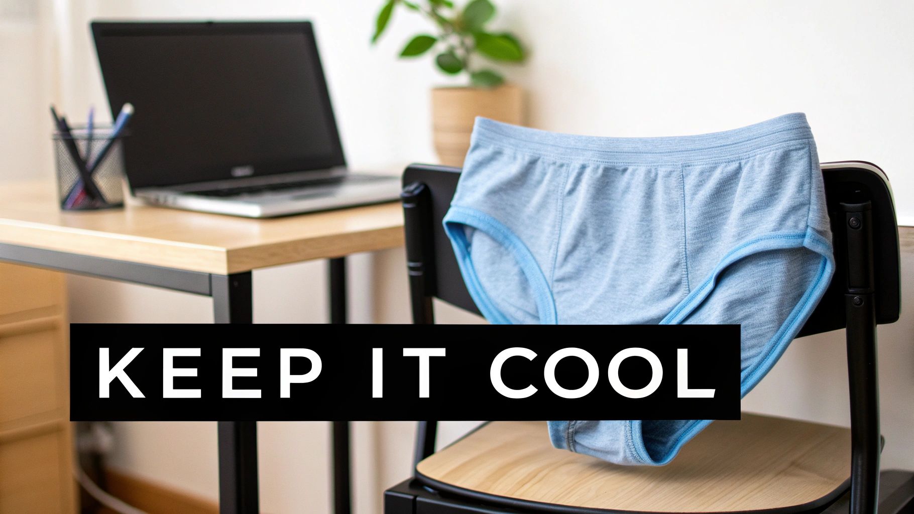 Light blue briefs hanging on a chair in a home office with a laptop and plant, featuring 'KEEP IT COOL' text.