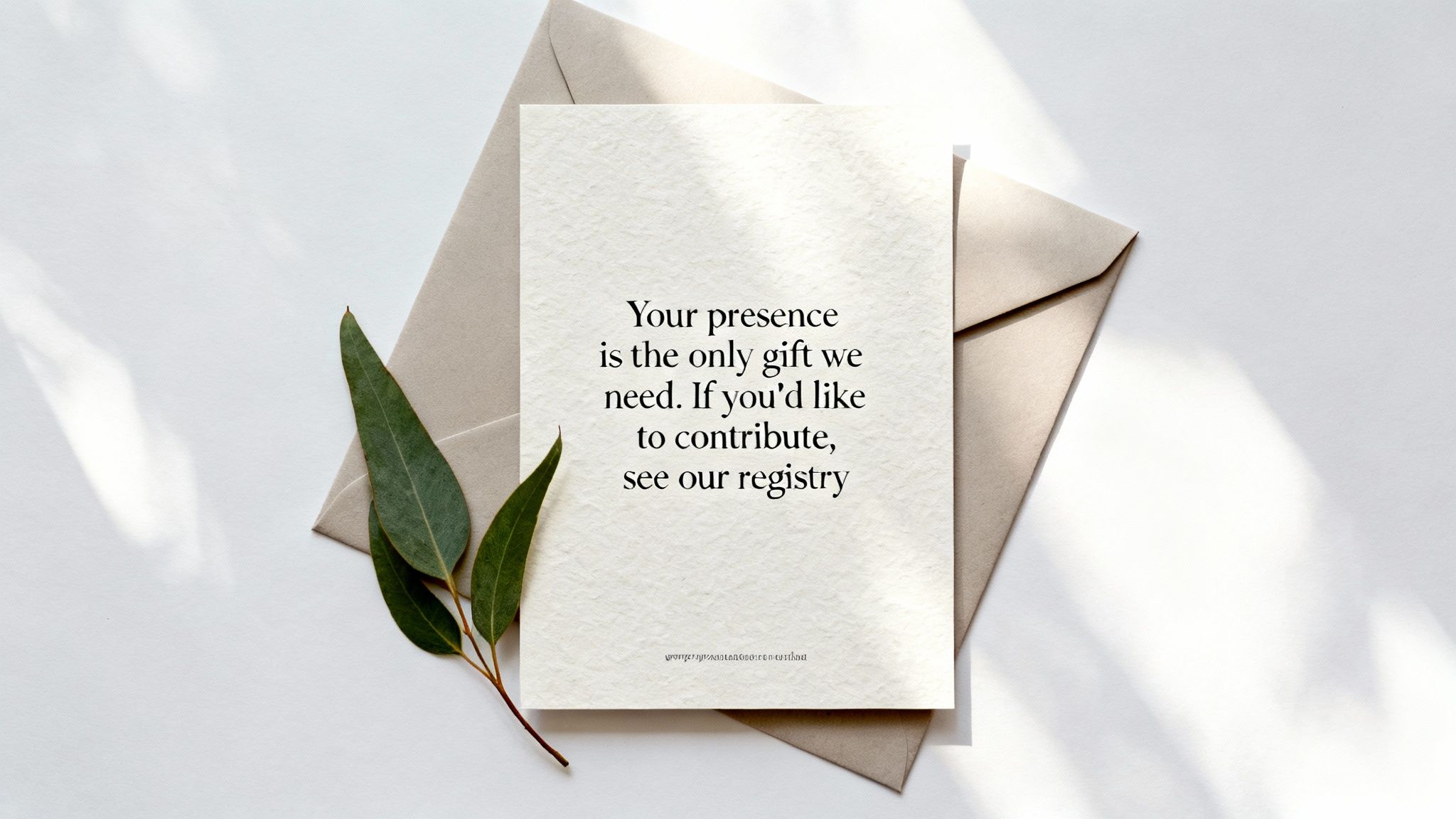 Wedding registry card with a gift message and eucalyptus leaves on a white background.