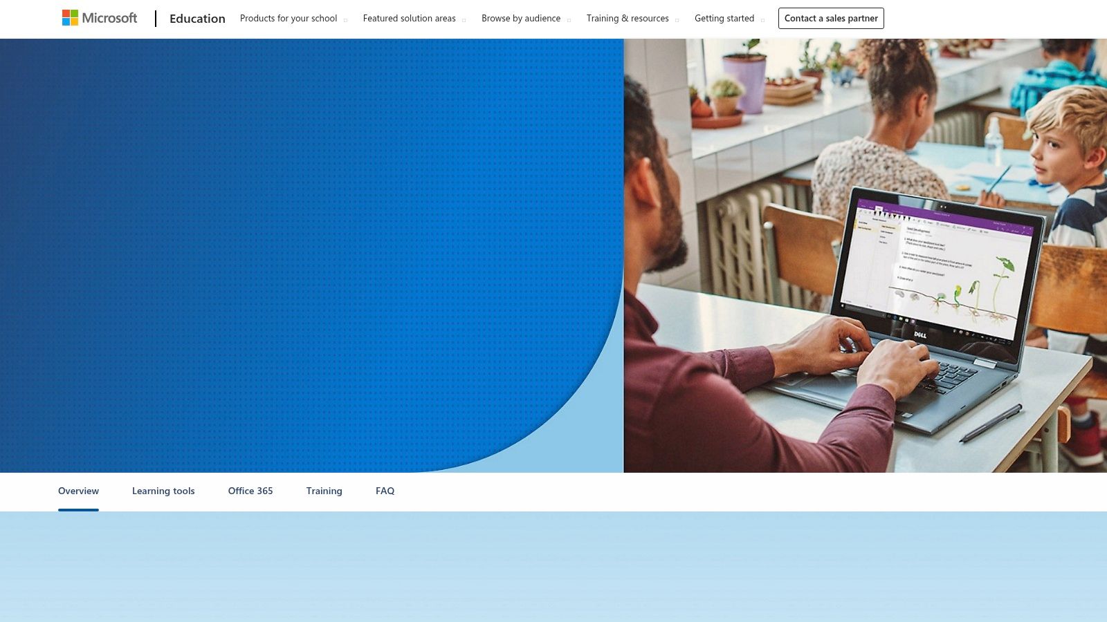 A classroom setting where students are using laptops and tablets with OneNote for collaborative learning.