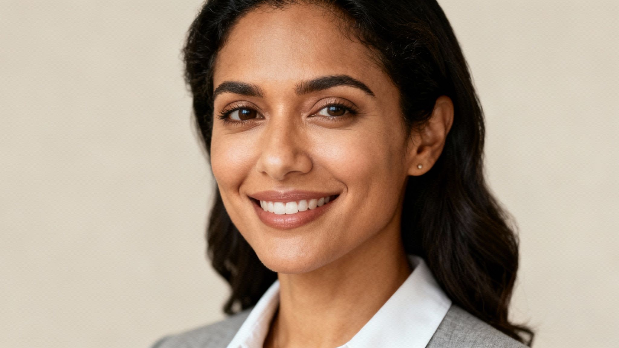 A professionally dressed woman with an AI-generated headshot for her LinkedIn profile