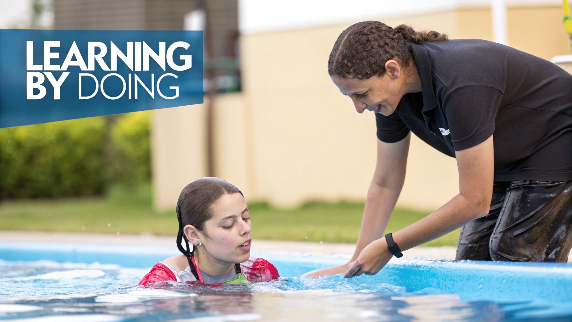 An instructor leans over to guide a young person in a swimming pool during a hands-on lesson.