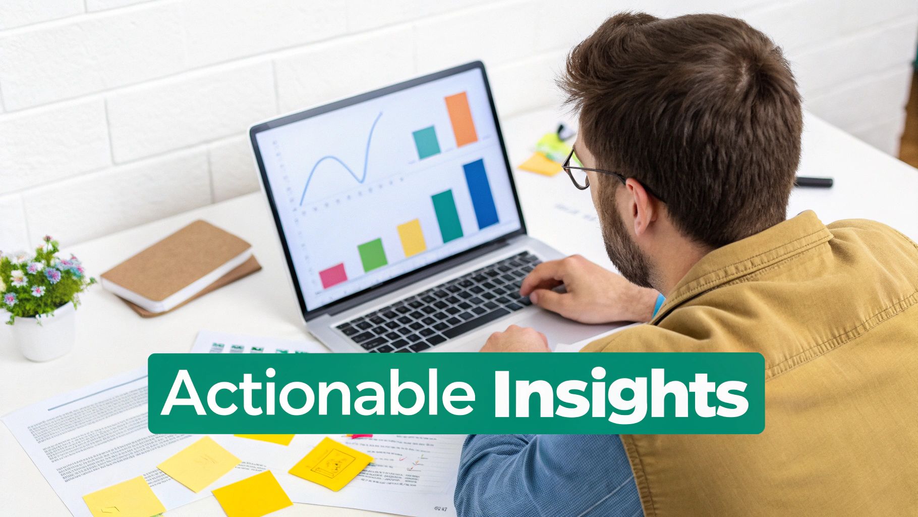 A person analyzing charts and graphs on a laptop, representing data-driven strategy.