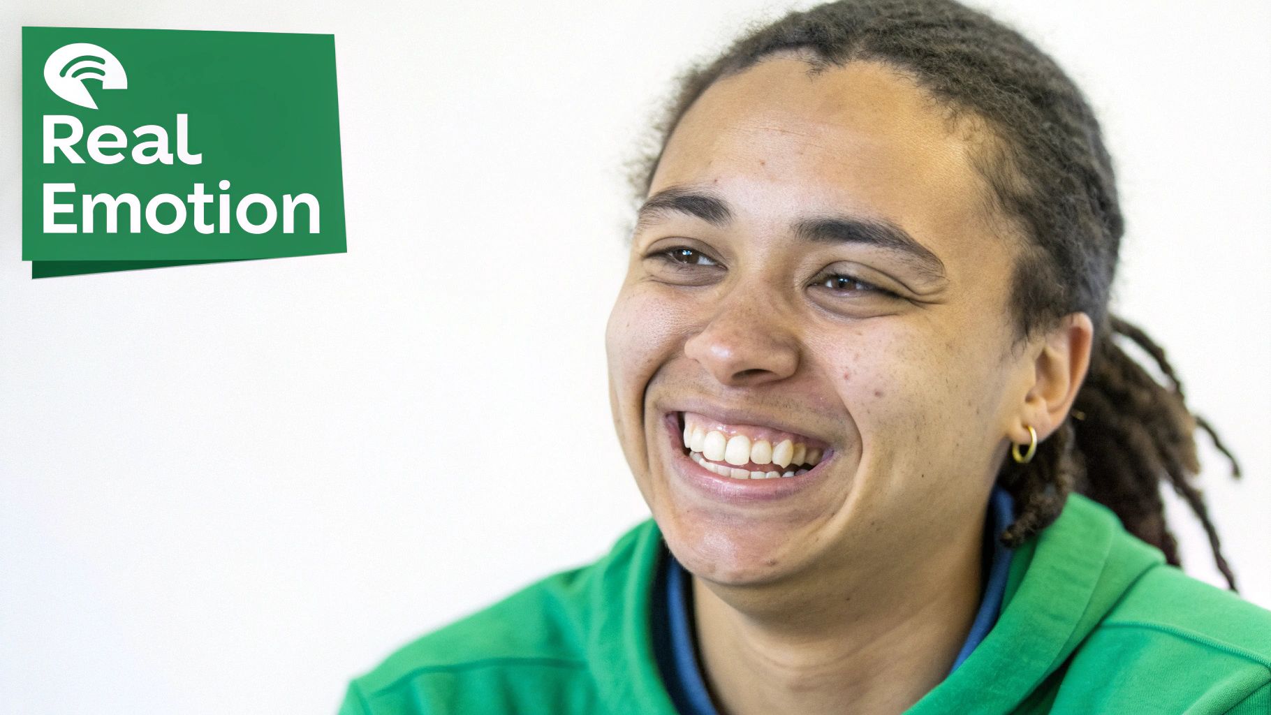 A person smiling with their eyes in a close-up selfie