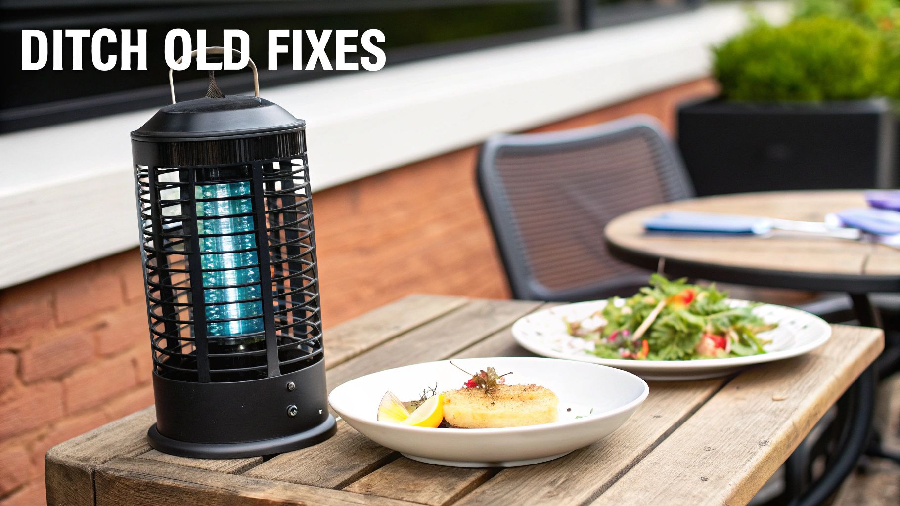 A black bug zapper on a rustic outdoor table with plates of food, highlighting an outdoor dining scene.