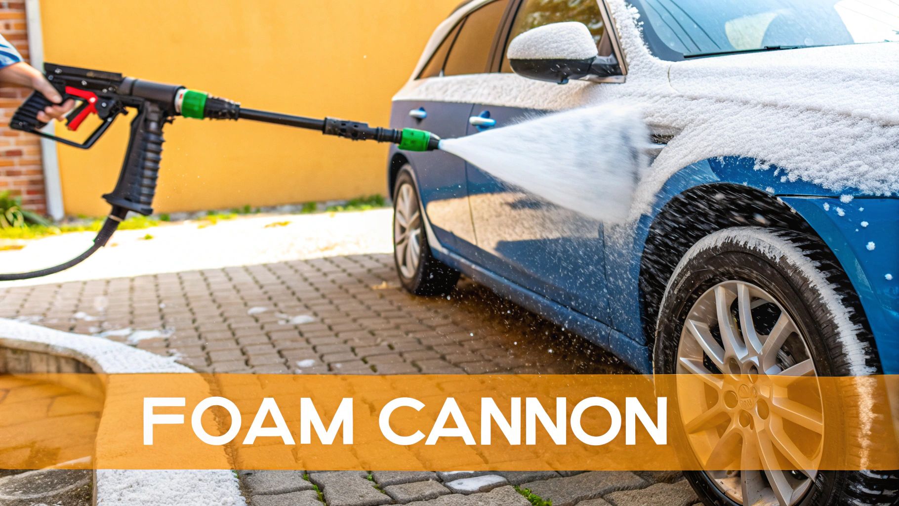 A person using a foam cannon to cover a car in thick, white soap suds.