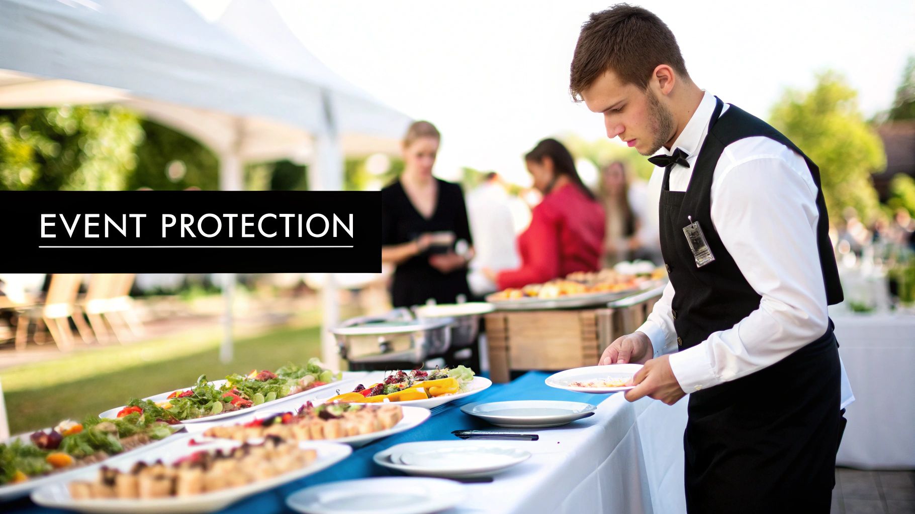 A catering staff member in a white shirt and black vest serves food at an outdoor buffet with other guests.